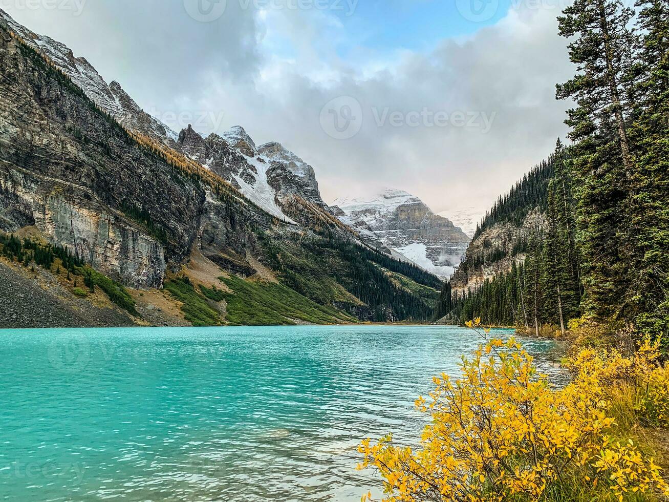 Snow capped moutains and glacier at Lake Louise in Banff National Park, Alberta photo