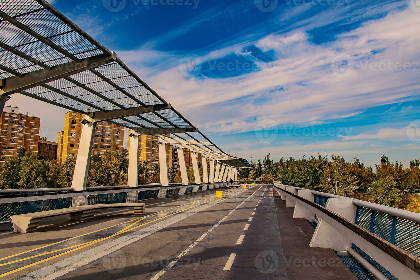 landscape of the pedestrian bridge of Zaragoza in a beautiful autumn day photo