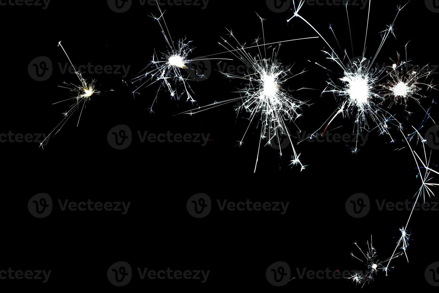 cold silver sparkles on a black background close-up photo