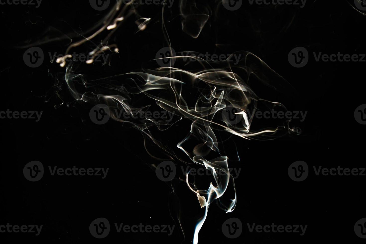 Smoke effect texture. Isolated background. Black and dark backdrop. Smokey fire and mistic effect. photo