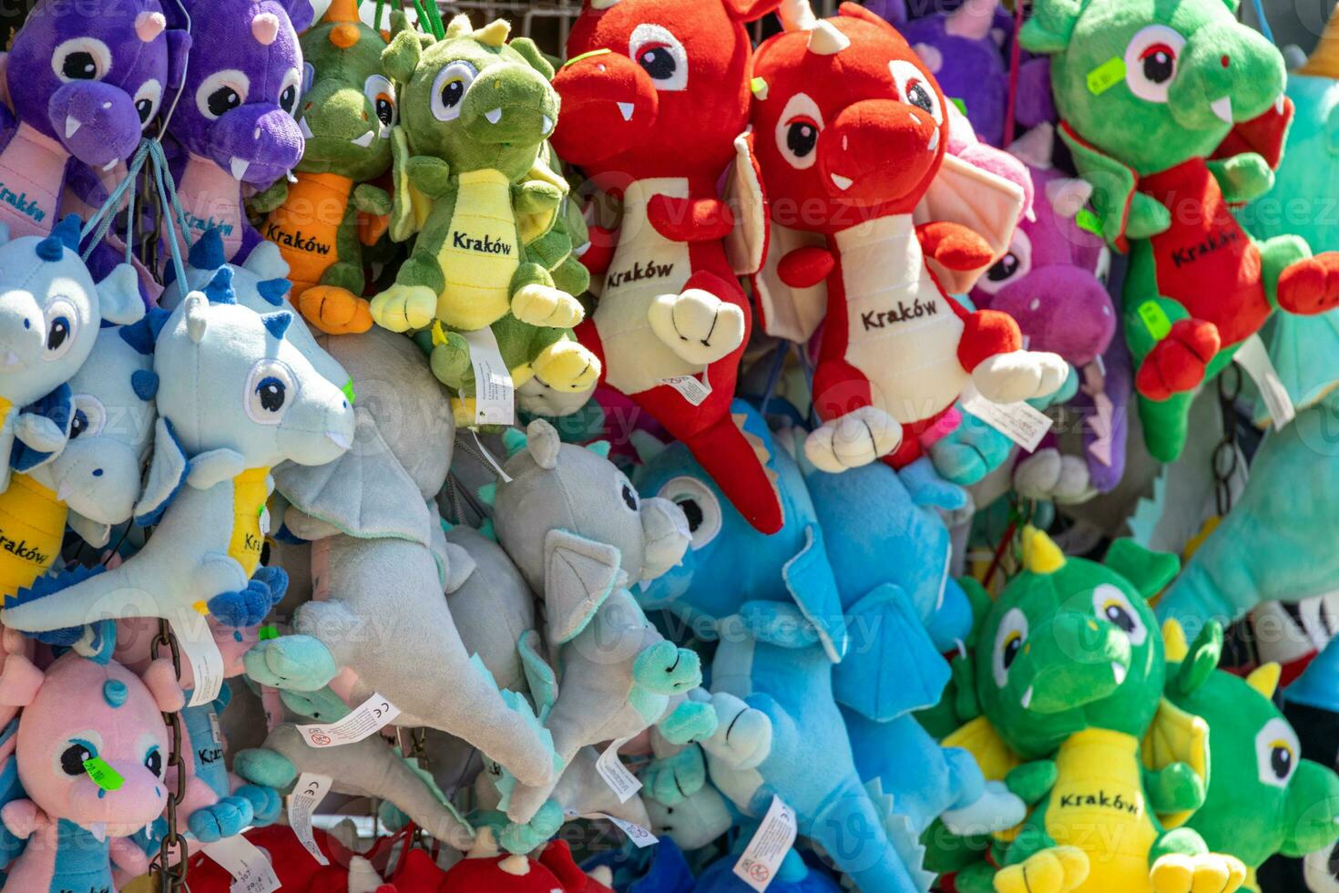 colorful background with plush dragons souvenirs from the Polish city of Krakow photo