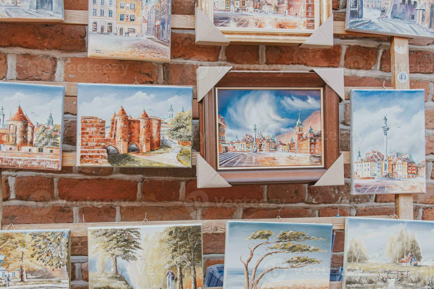 paintings on canvas showing the old town of warsaw in poland souvenirs from holidays photo