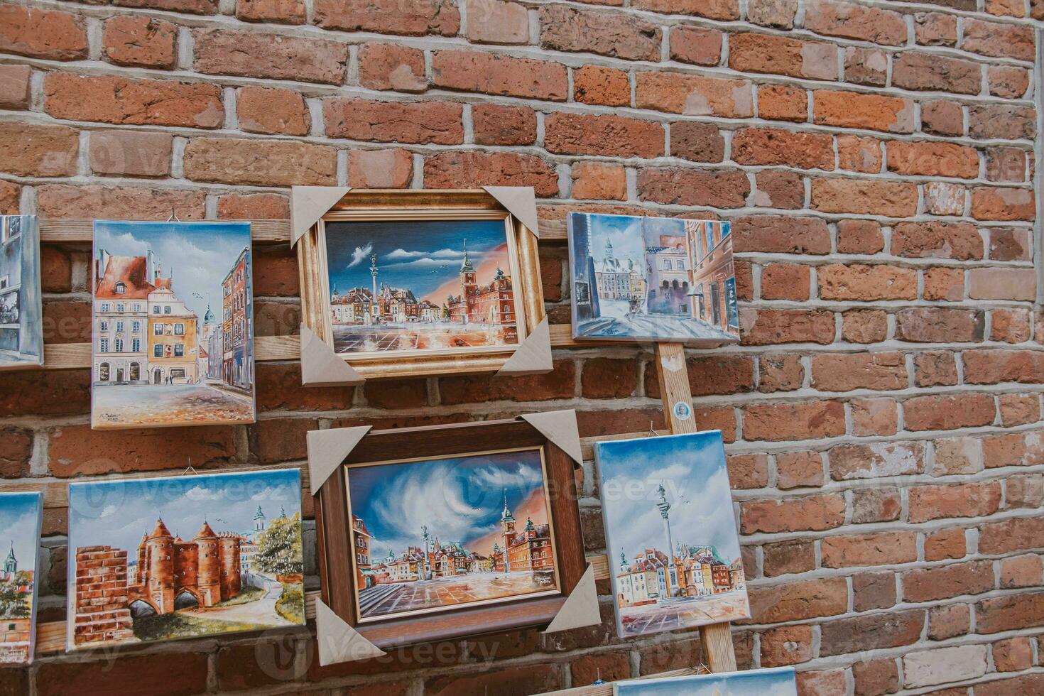 paintings on canvas showing the old town of warsaw in poland souvenirs from holidays photo