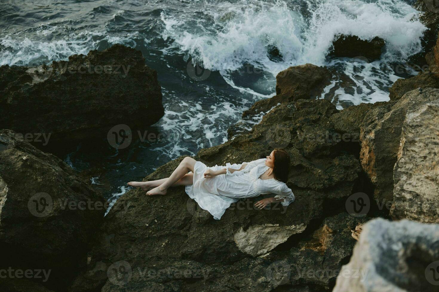 woman in white wedding dress on sea shore wet hair unaltered photo