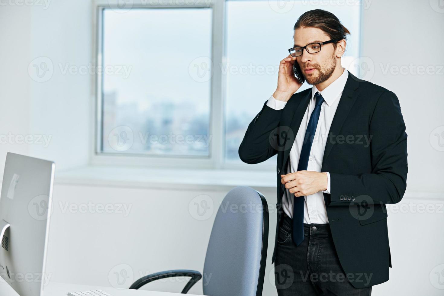 man in a suit an official is working at the computer technologies photo