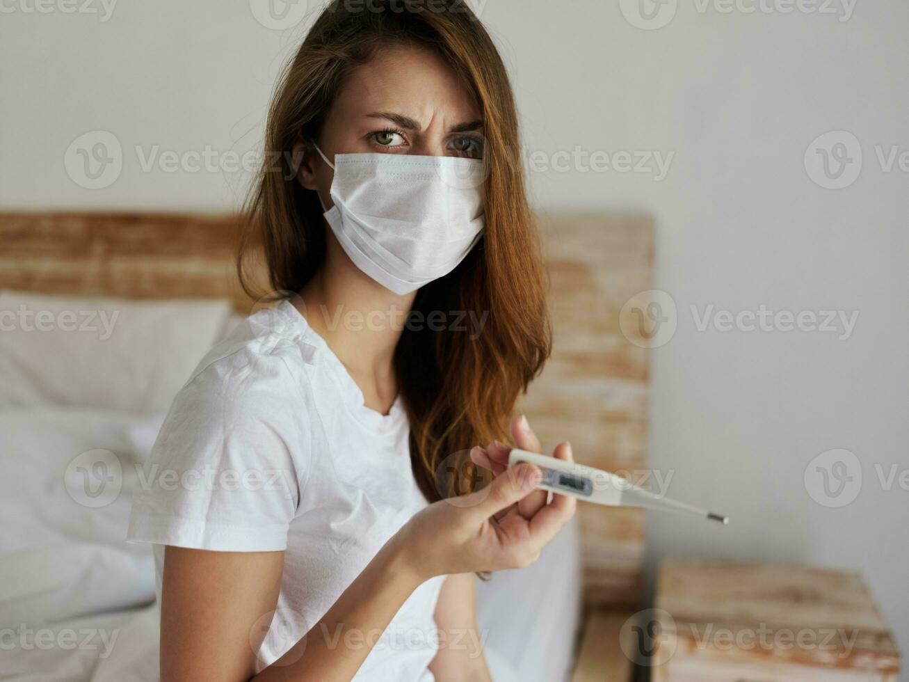 woman wearing medical mask thermometer health check dissatisfied facial expression photo