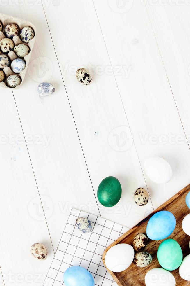 church holiday easter colorful eggs on chalkboard and wooden background photo