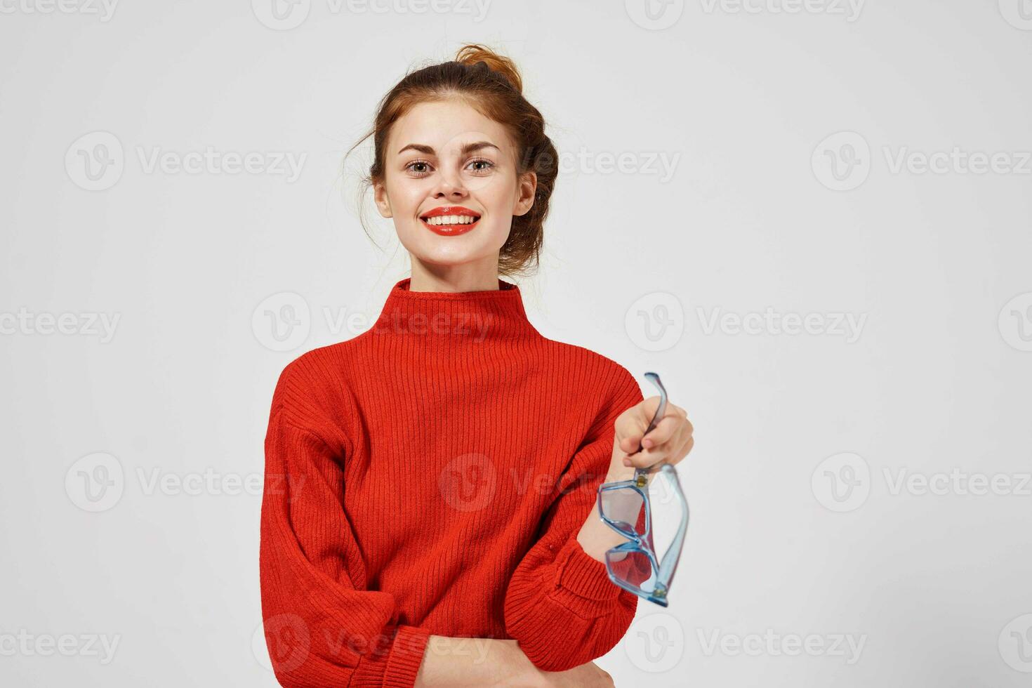 portrait of a woman in a red sweater Lifestyle light background photo