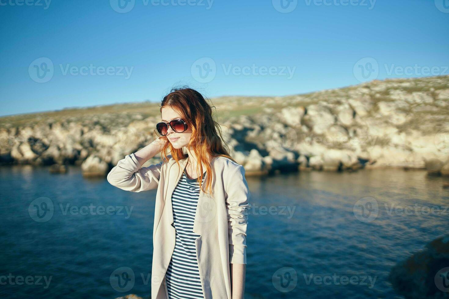 cheerful woman wearing sunglasses travel walk summer freedom photo