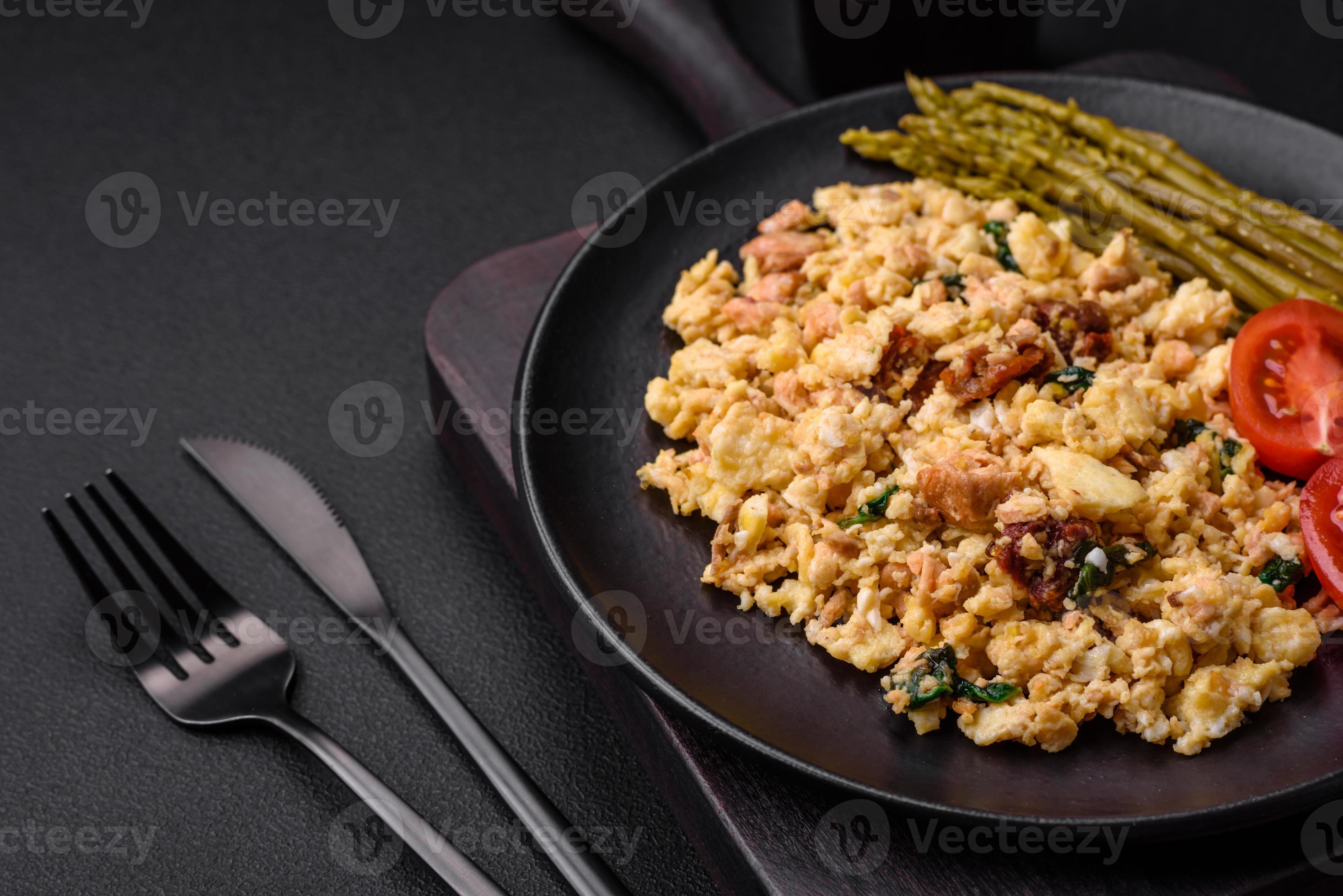 Delicious scramble with salmon, sundried tomatoes, spinach, spices and