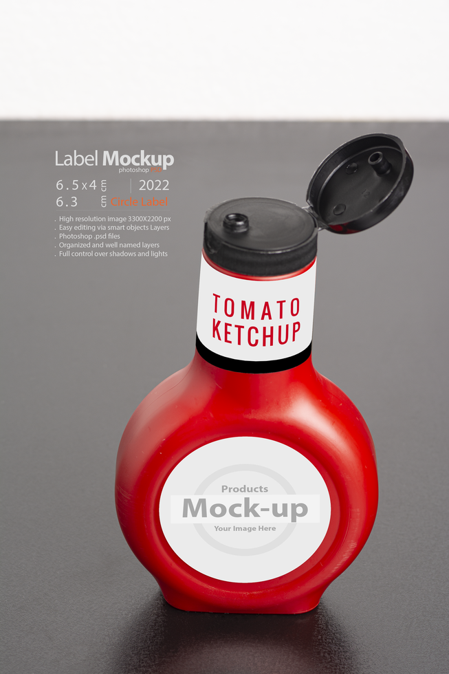 Tomato sauce bottle with cap on black table psd