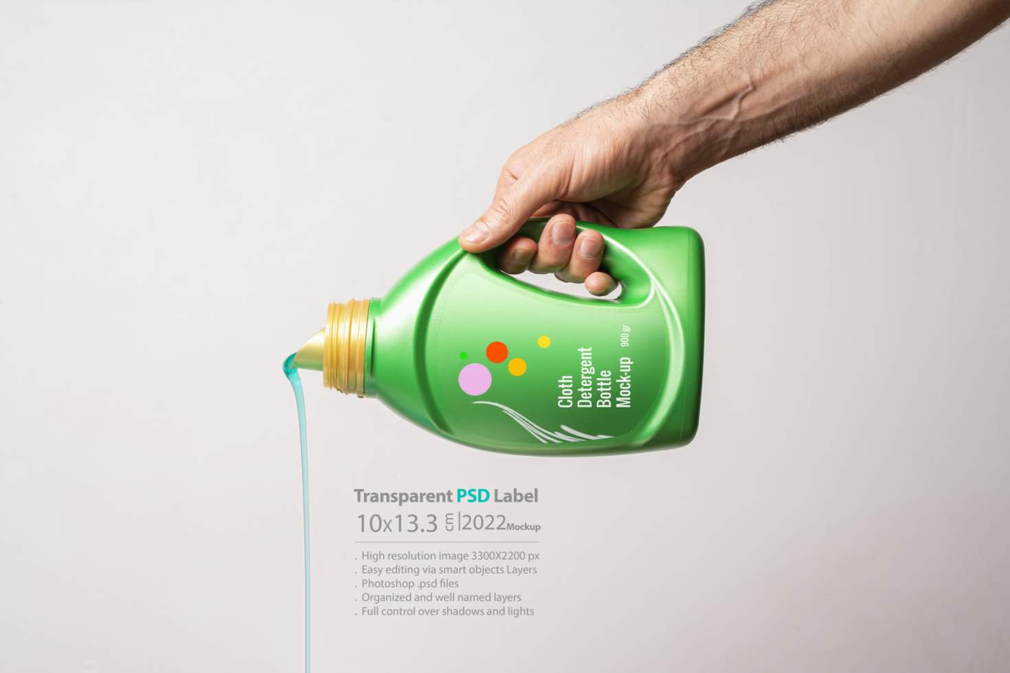 Pouring detergent liquid from green bottle in front of light gray background psd