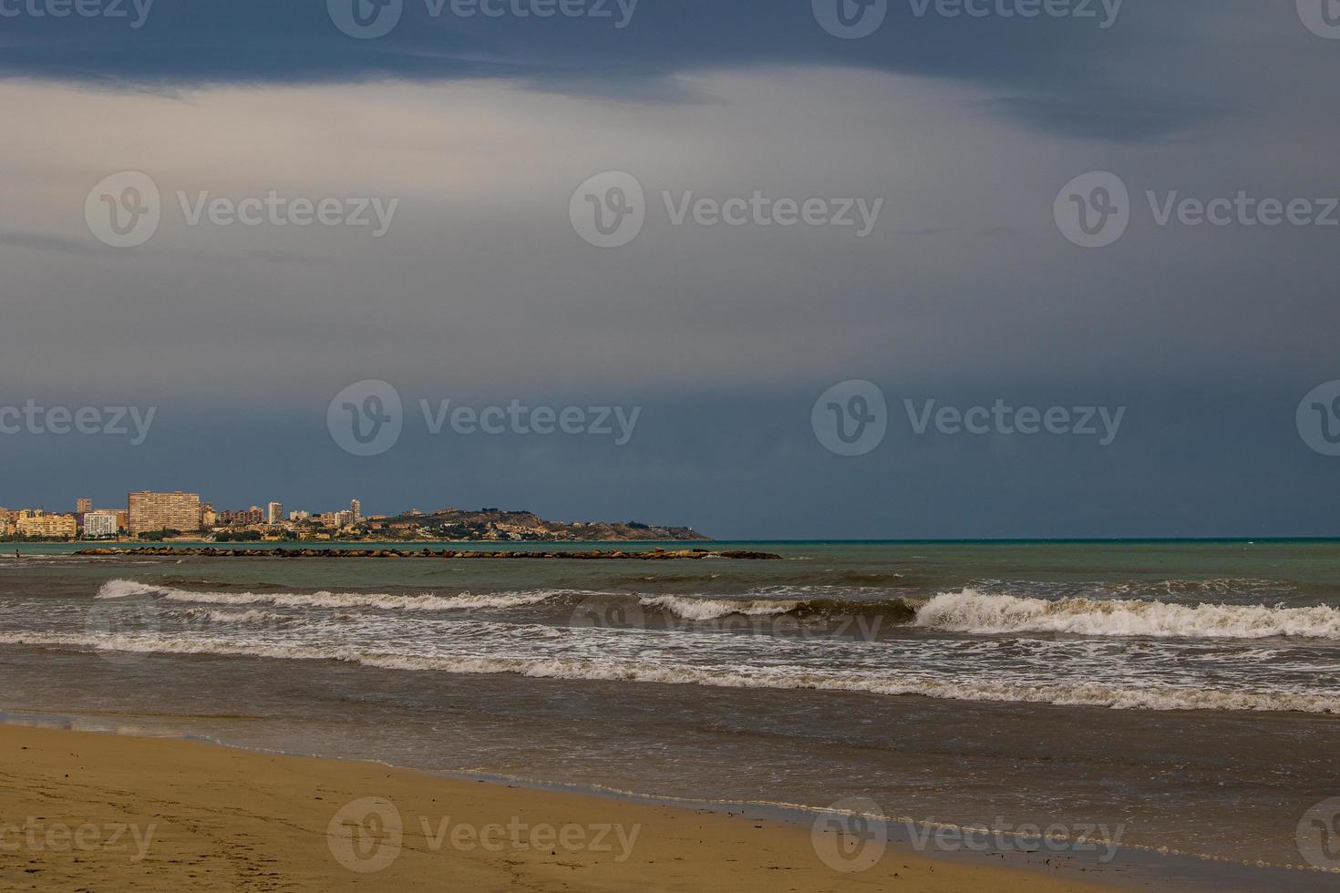 calm seaside landscape in alicante spain on a cloudy day photo