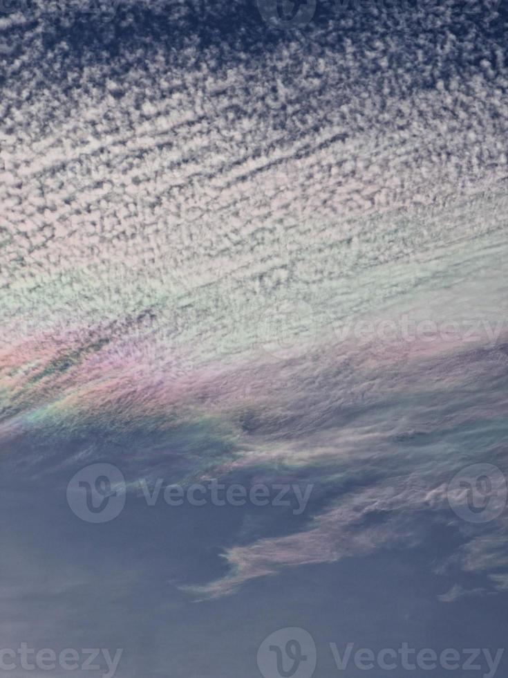 cloud in blue sky with rainbow tint natural background photo