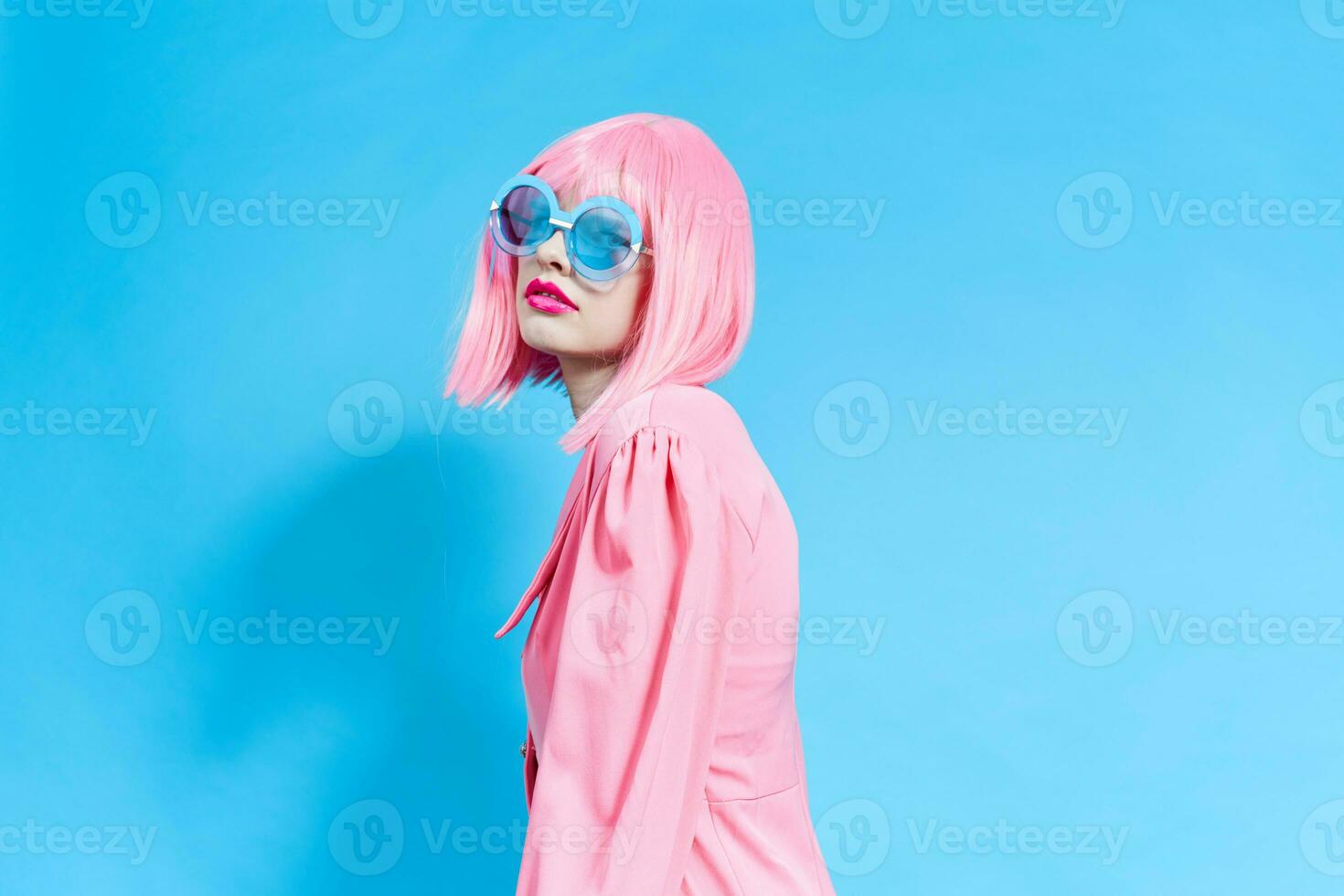 glamorous woman in pink dress wig bright makeup photo