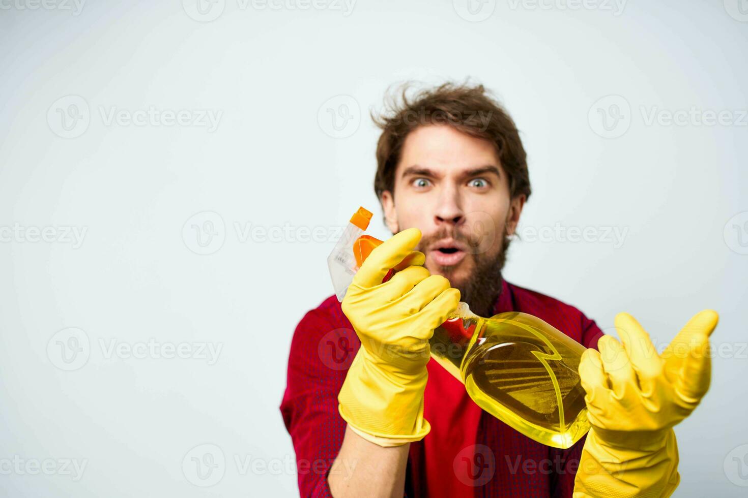 Male professional detergent cleaning service light background photo