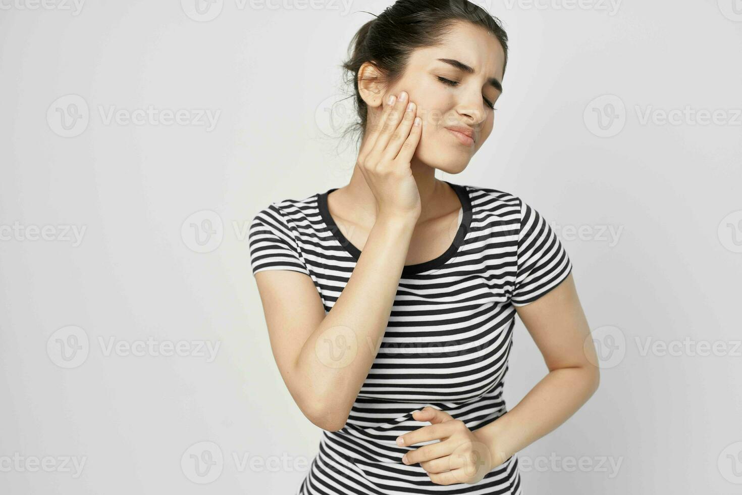 emotional woman dentistry health problems discomfort light background photo