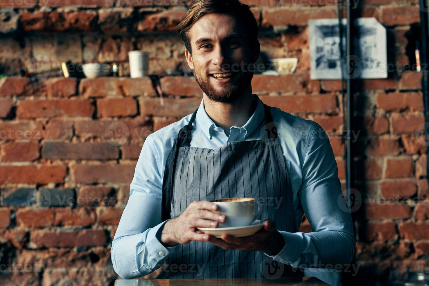 male waiter wearing apron coffee cup service lifestyle photo