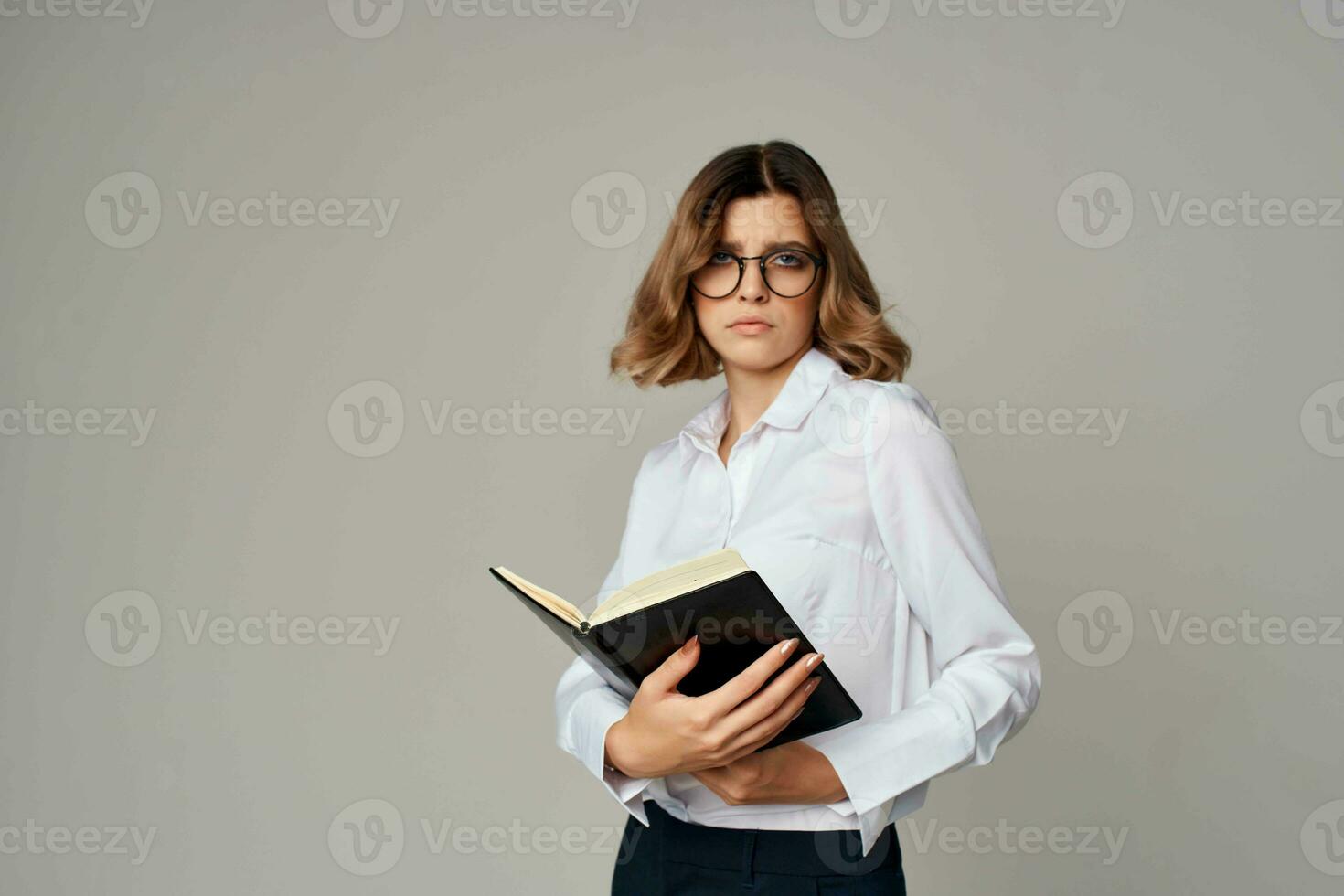 Business woman with notepad in hands professional office official photo