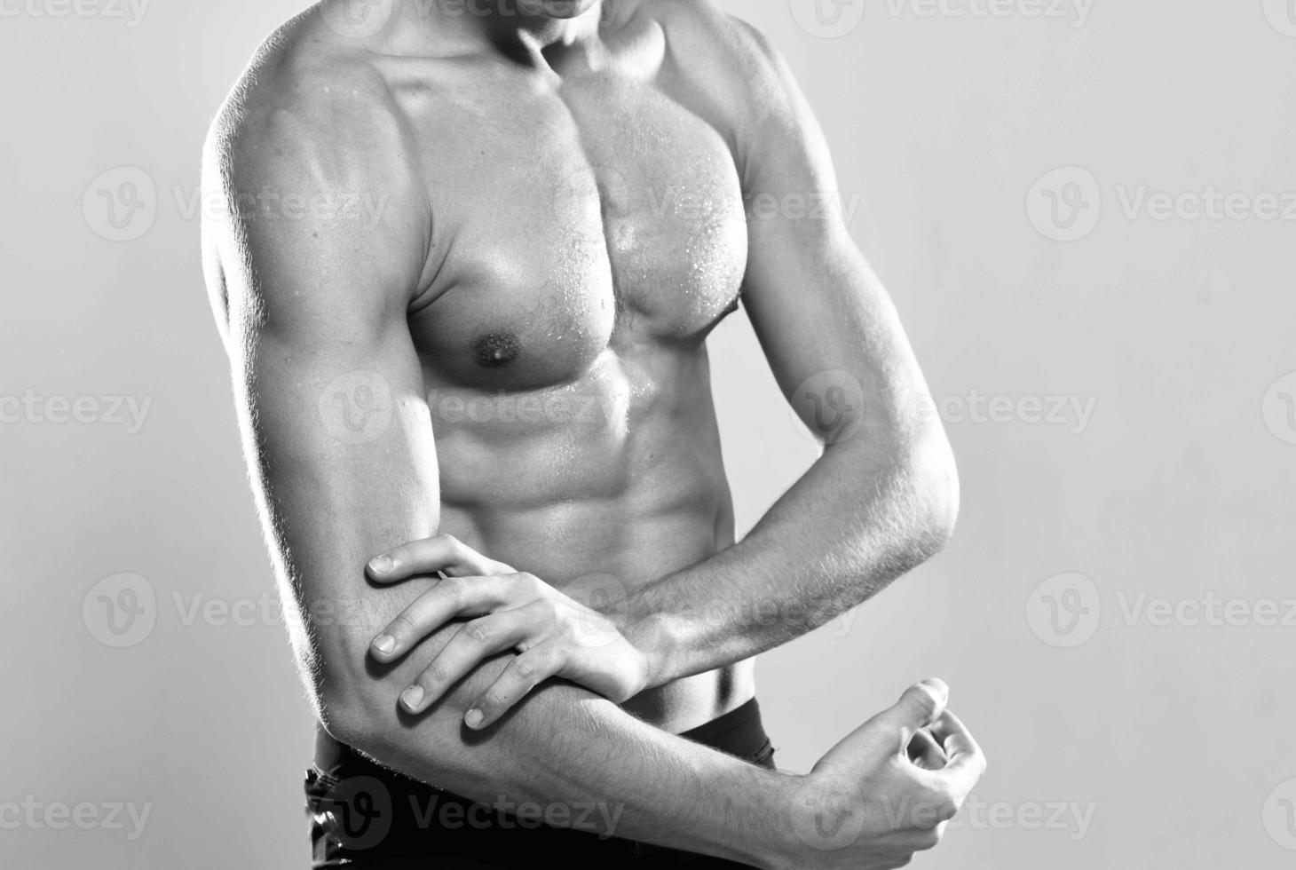 male athlete inflated torso workout posing gym photo