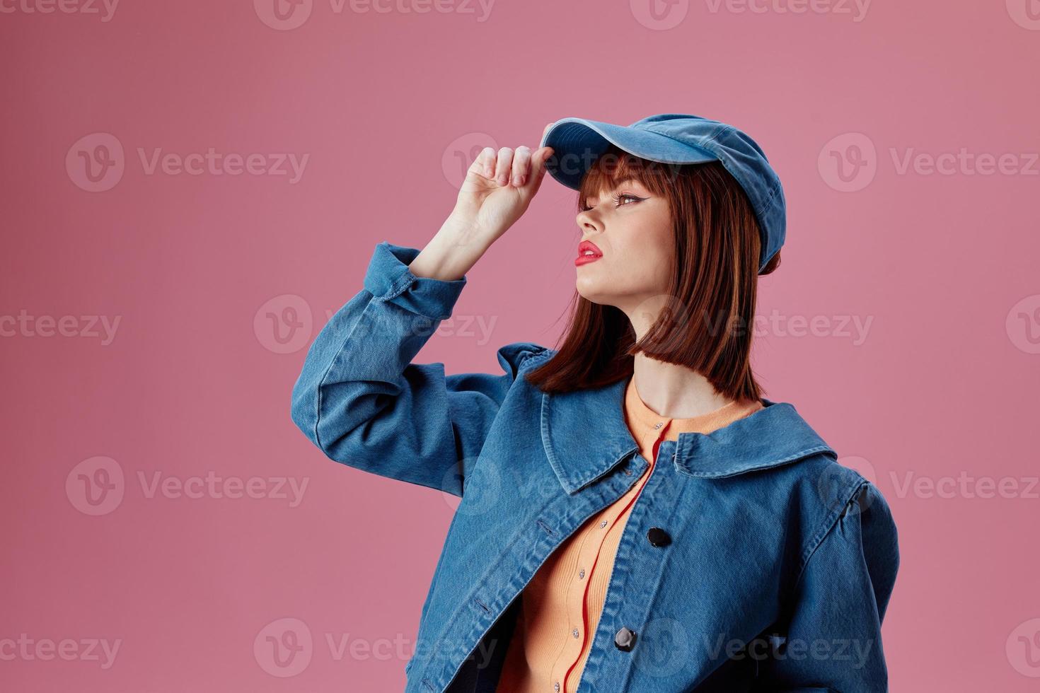 pretty woman denim clothing fashion posing cap color background unaltered photo