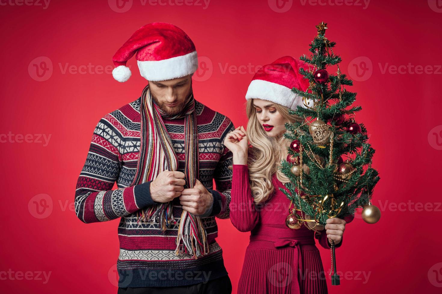 merry married couple celebrate christmas new year red background photo