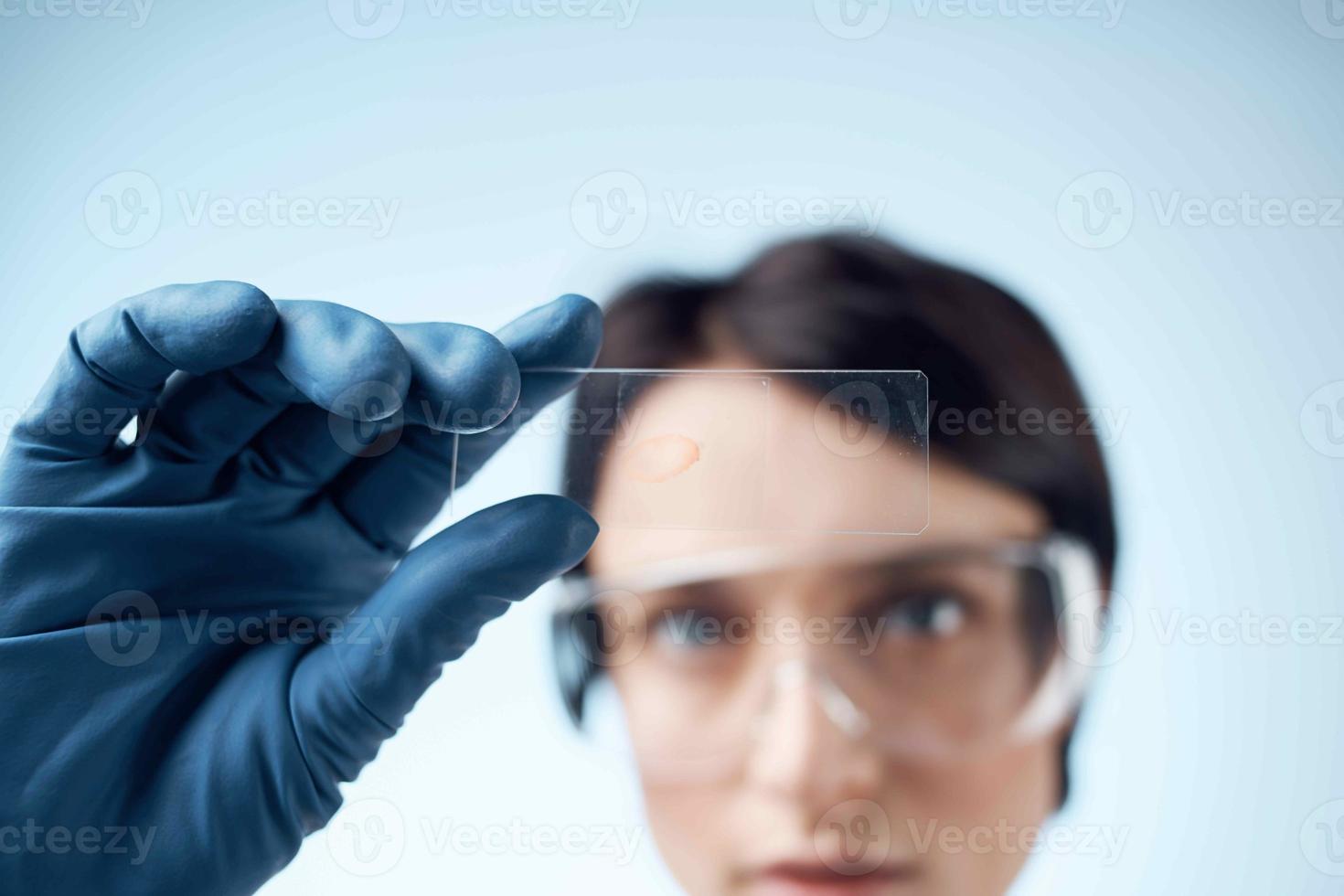 woman with blue gloves test research analysis diagnostics photo