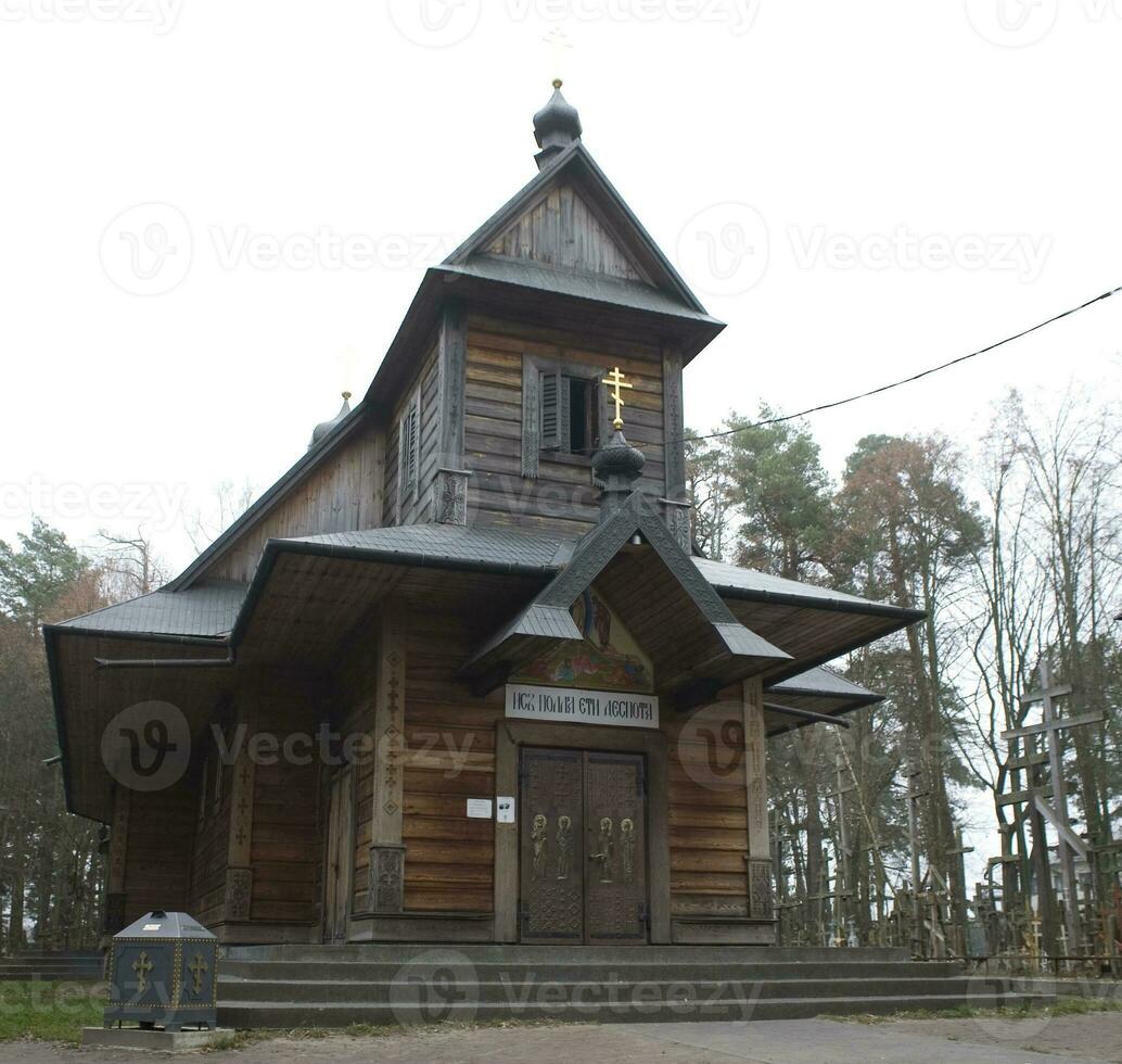 wooden church and crosses on Grabarka mountain in poland on an autumn day photo