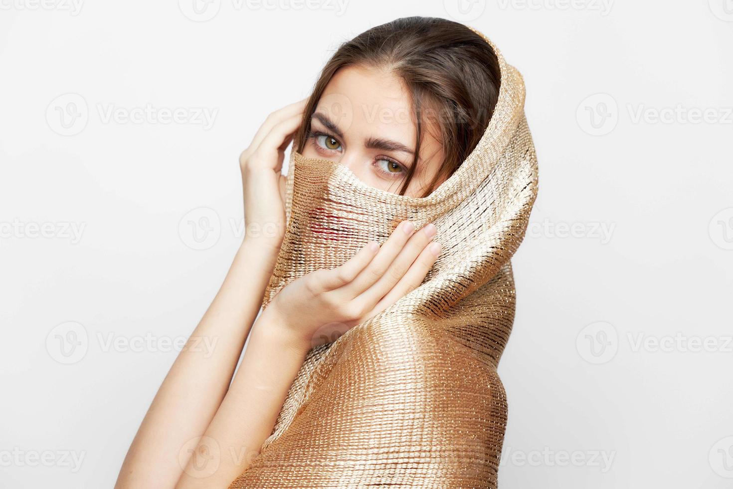A portrait of a woman with a scarf Muslim religion covers the face elegant style photo