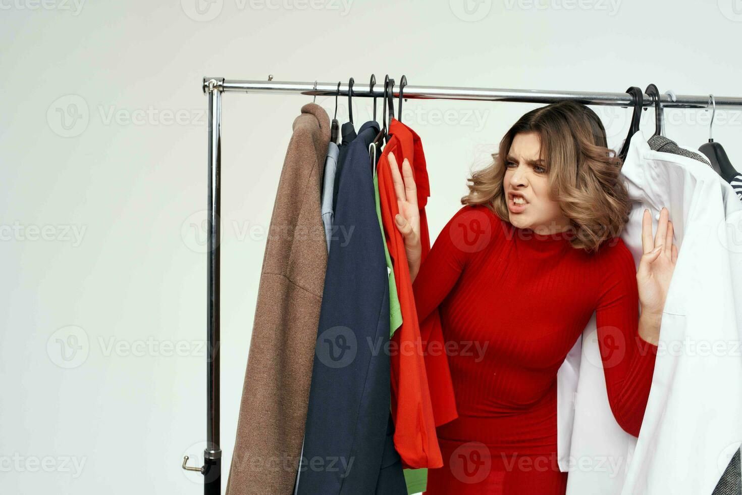 pretty woman with glasses trying on clothes shop shopaholic isolated background photo