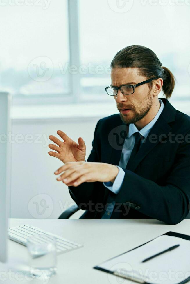 The man in a suit emotions work head documents executive photo