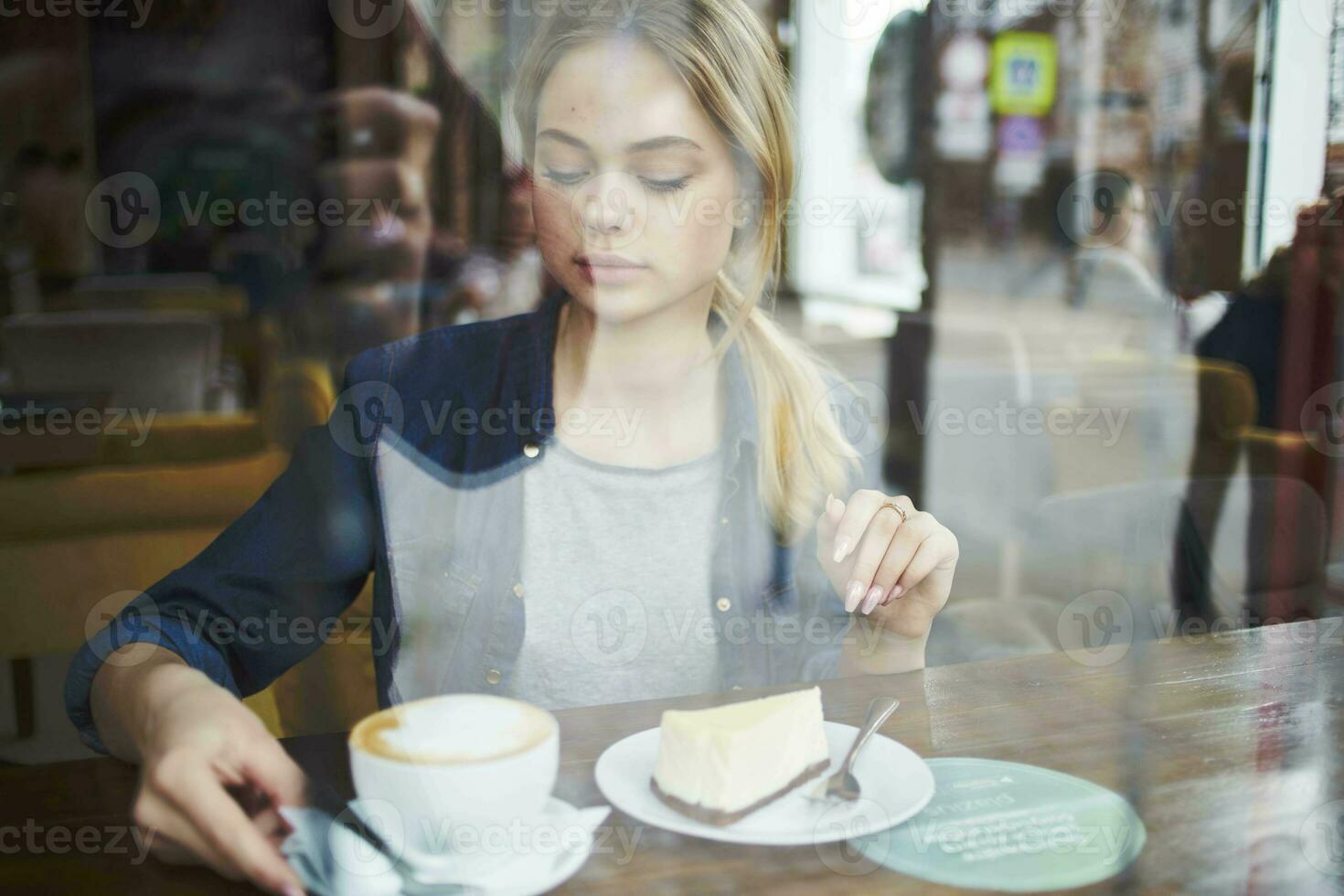 Cheerful woman cup of coffee cake lifestyle leisure photo