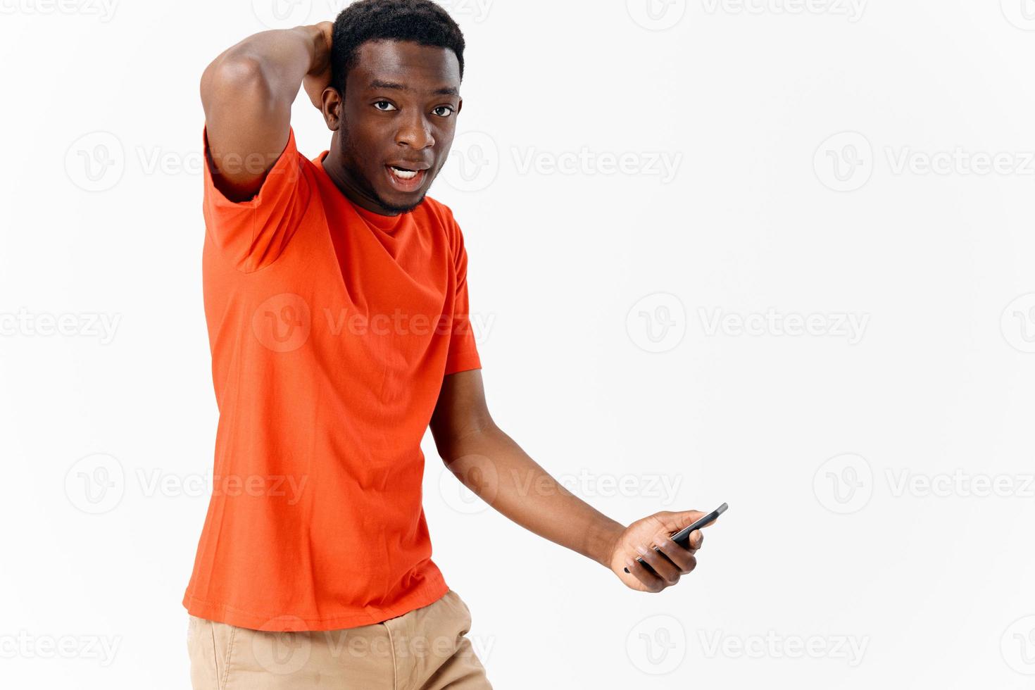 emotional African American with a phone in the hands of technology copy space photo