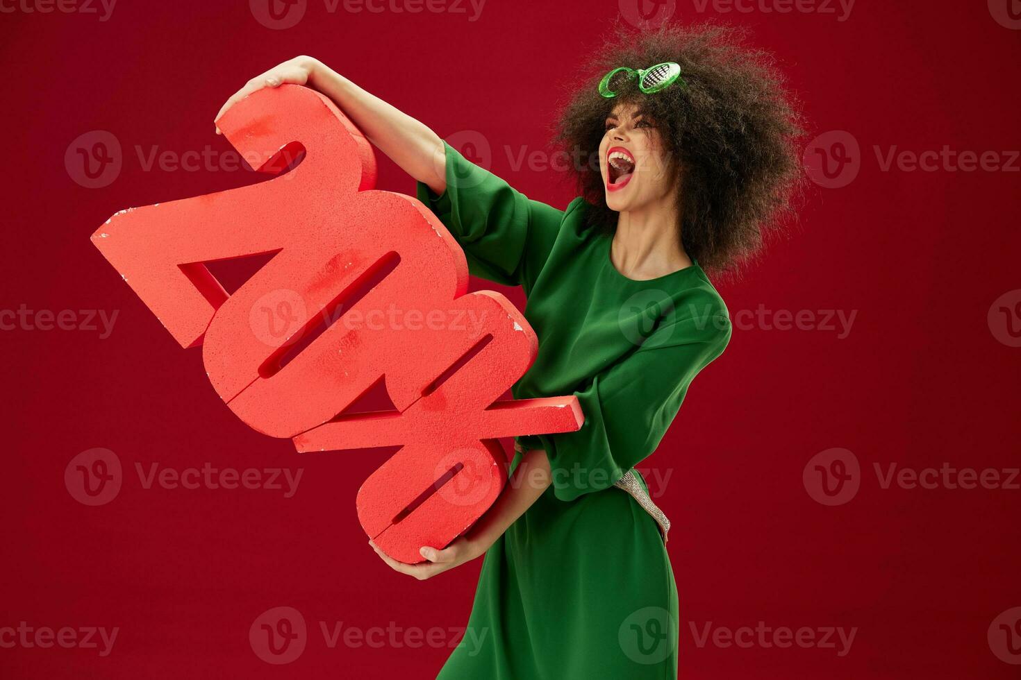 pretty woman holding red twenty percent discount advertising red background unaltered photo