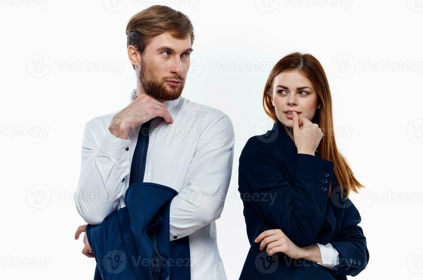 young couple wearing suits stands next to work colleagues communicating finance photo