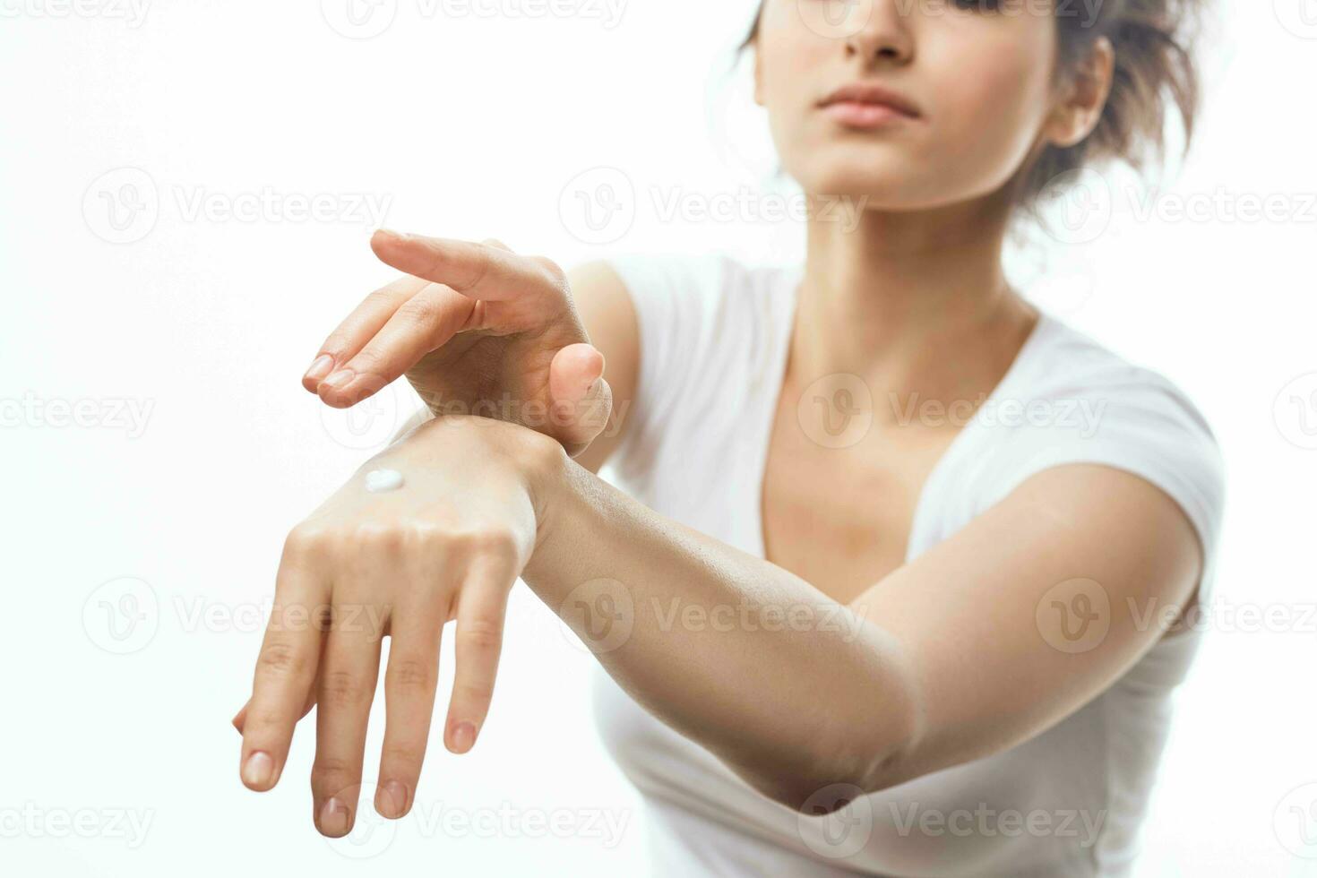 woman with cream skin care cosmetics health light background photo