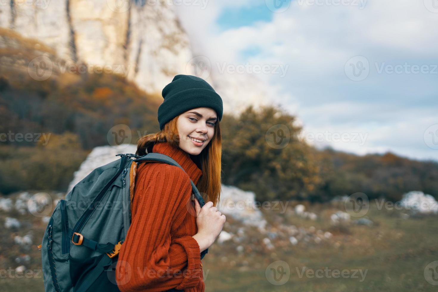 cheerful woman hiker backpack walk vacation freedom mountains photo