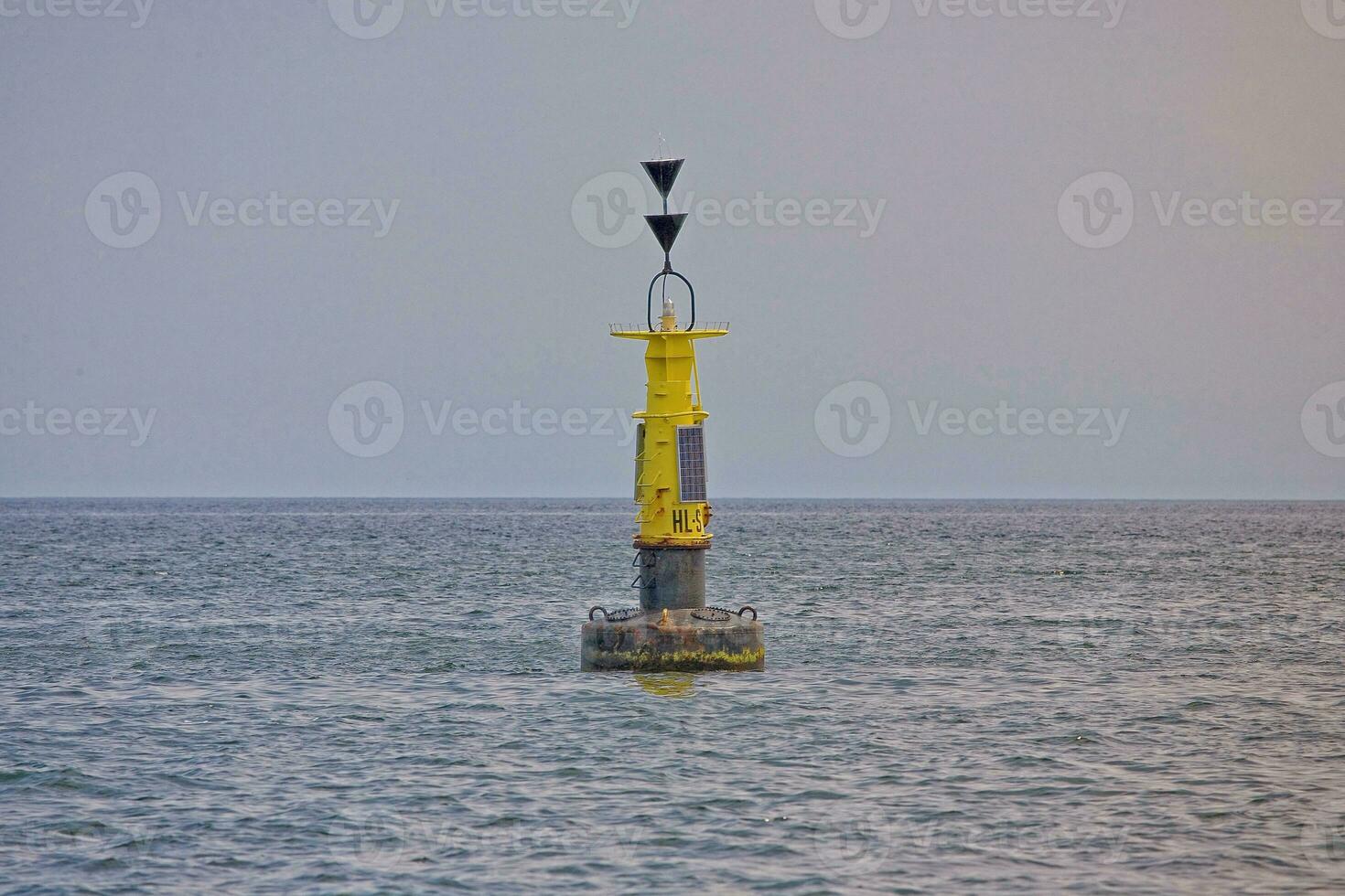 yellow signal buoy in the Baltic Sea photo