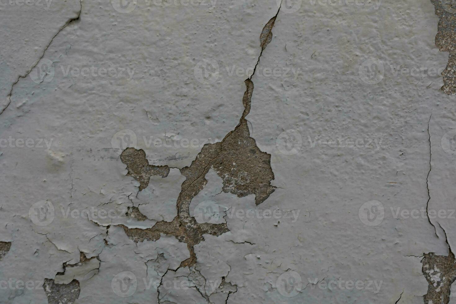 background of old colorful wall with cracked plaster in close-up photo