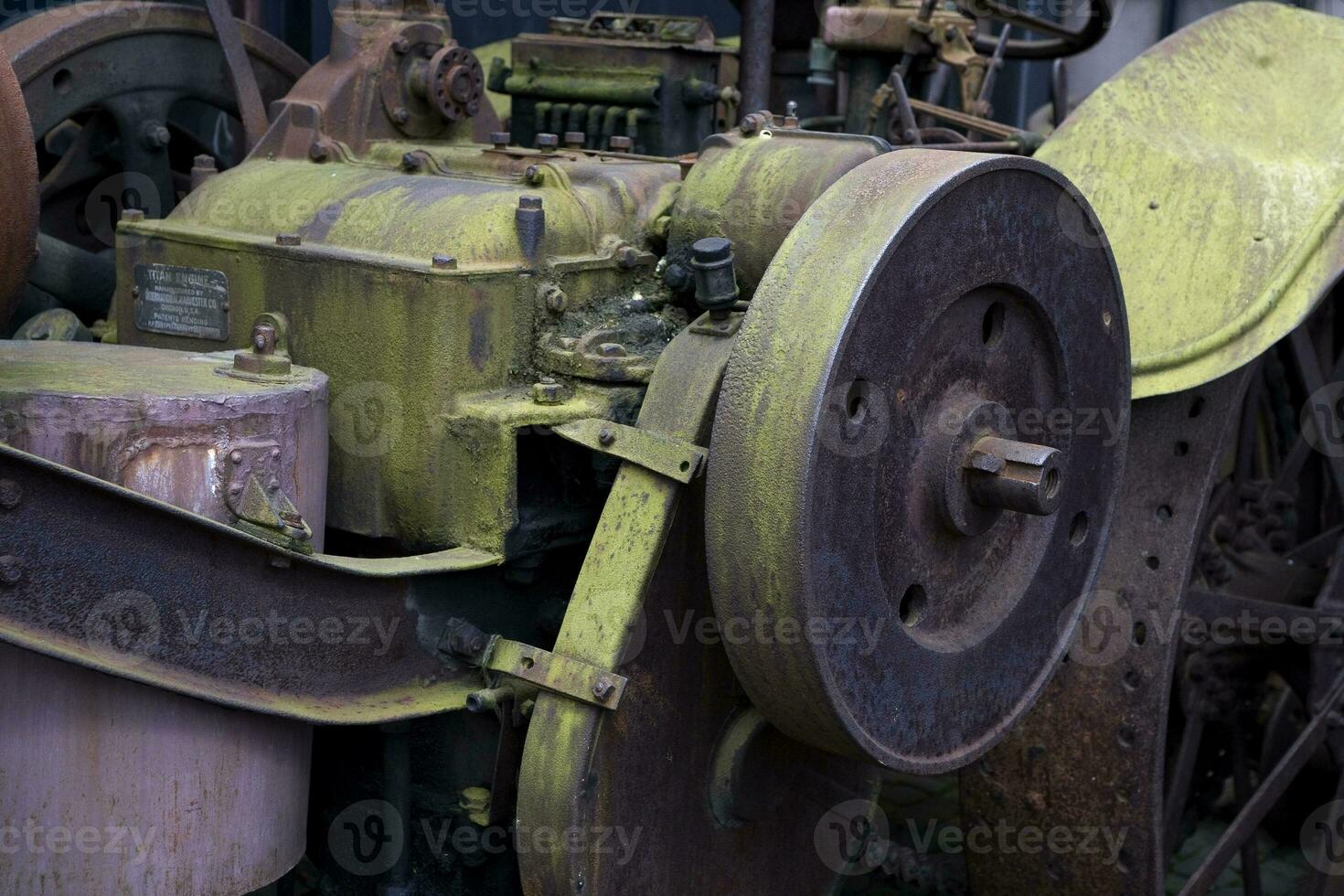 antique metal car forming a mechanical background in a museum photo