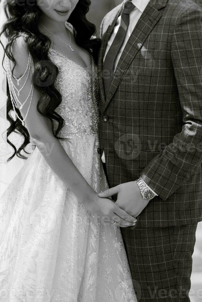 the first meeting of the bride and groom in the courtyard of the hotel photo