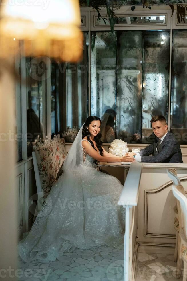 bride and groom inside a cocktail bar photo