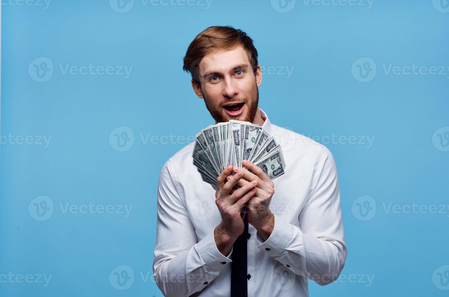 Cheerful man with bundles of money wealth emotion joy photo