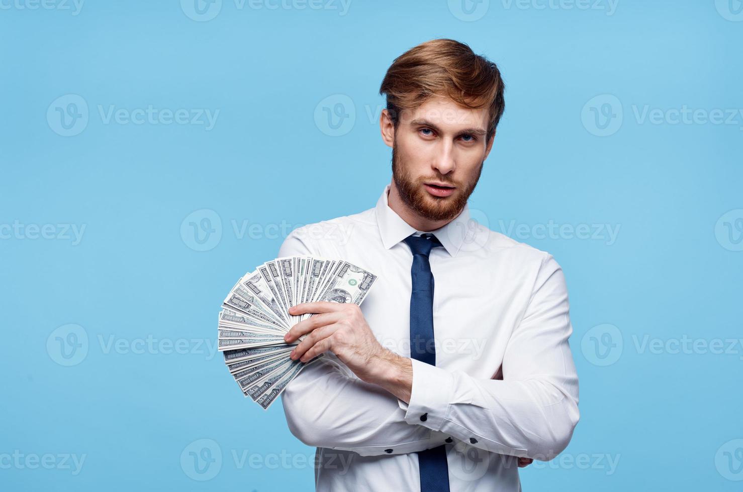 Virgo man in tie with money in hands wealth success self-confidence photo