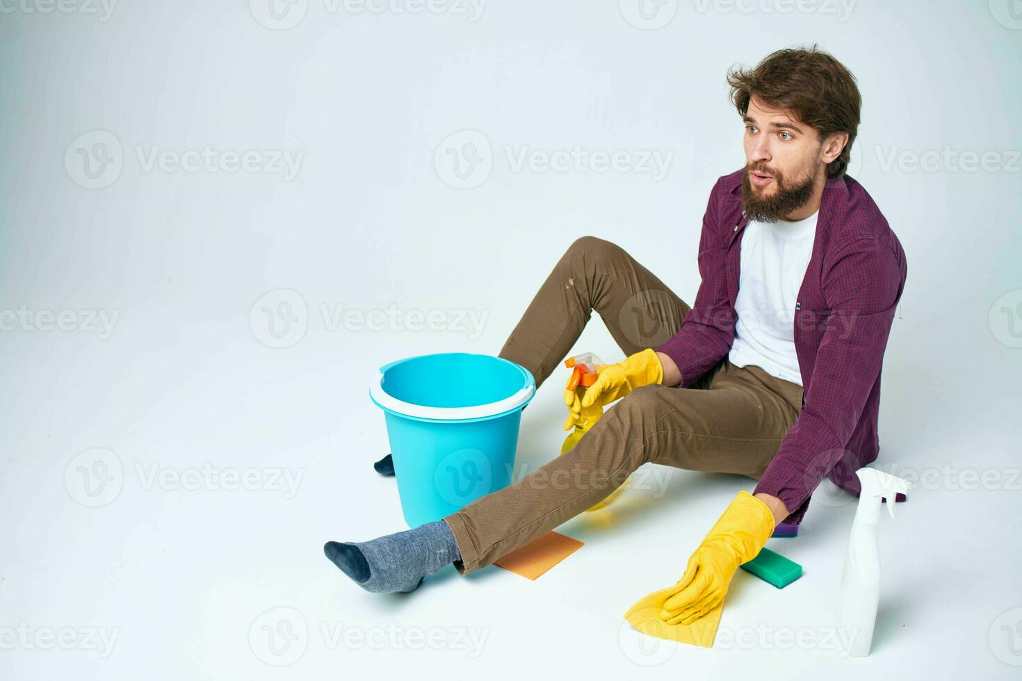 Man with detergent in the hands of a car wash providing housework hygiene services photo