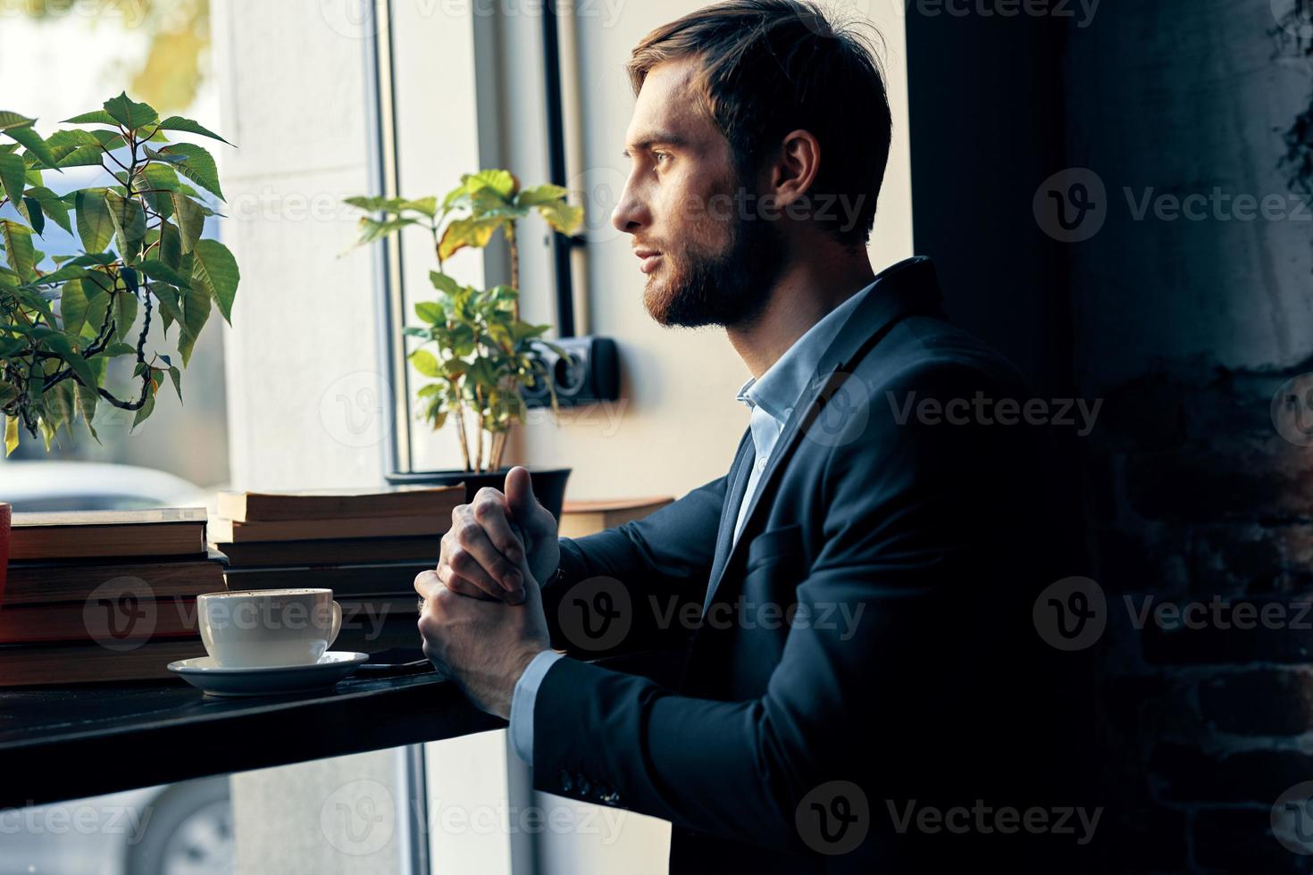 business man in a suit sitting in a cafe leisure manager finance photo