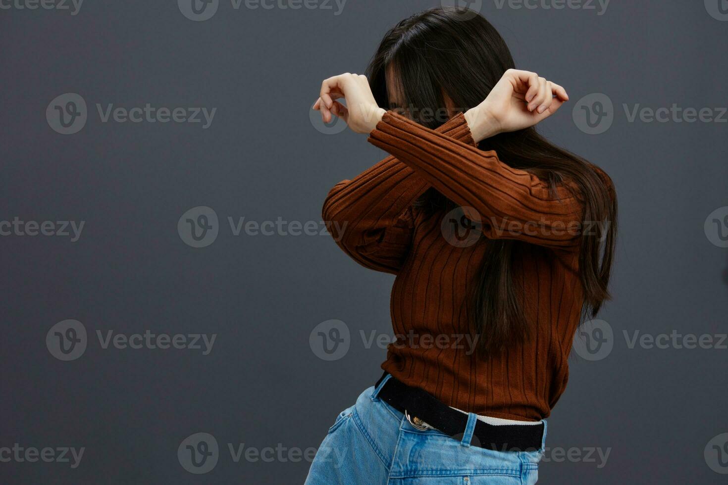 pretty woman fun brown sweater posing casual wear isolated background photo