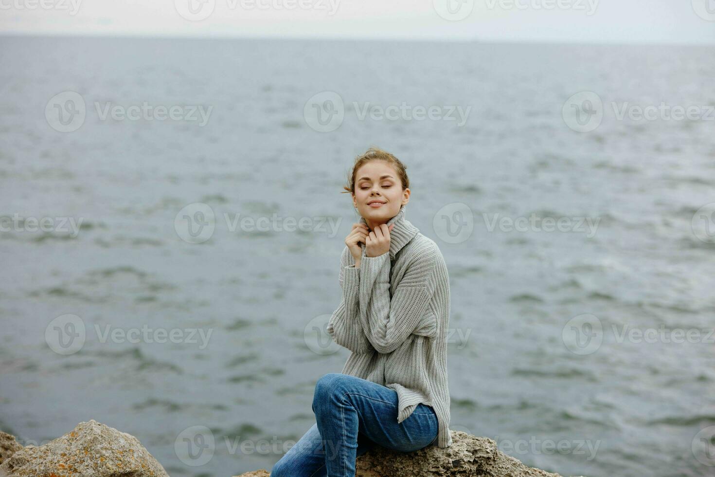 woman sweaters cloudy sea admiring nature female relaxing photo