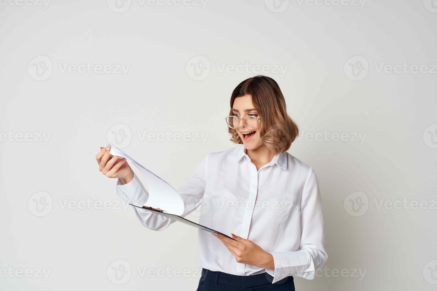 Business woman in white shirt papers emotions light background photo