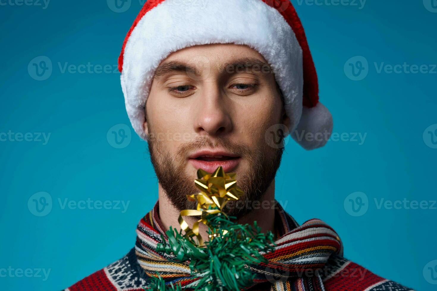 Cheerful man with a tree in his hands ornaments holiday fun studio posing photo